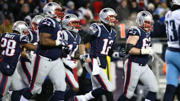 FOXBOROUGH, MA - JANUARY 13: Tom Brady #12 of the New England Patriots reacts with teamates after a touchdown during the fourth quarter in the AFC Divisional Playoff game against the Tennessee Titans at Gillette Stadium on January 13, 2018 in Foxborough, Massachusetts. (Photo by Jim Rogash/Getty Images)
