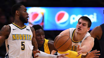 DENVER, CO APRIL 3: Indiana Pacers guard Victor Oladipo (4) steals the ball from Denver Nuggets center Nikola Jokic (15) as Denver Nuggets forward Will Barton (5) looks back during the fourth quarter on April 3, 2018 at Pepsi Center. (Photo by John Leyba/The Denver Post via Getty Images)