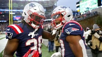 FOXBOROUGH, MASSACHUSETTS - NOVEMBER 28: Damien Harris #37 of the New England Patriots celebrates with Rhamondre Stevenson #38 after scoring a rushing touchdown against the Tennessee Titans in the fourth quarter at Gillette Stadium on November 28, 2021 in Foxborough, Massachusetts. (Photo by Adam Glanzman/Getty Images)