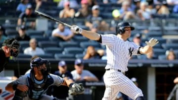 Sep 11, 2016; Bronx, NY, USA; New York Yankees left fielder Brett Gardner (11) hits an RBI single against the Tampa Bay Rays during the seventh inning at Yankee Stadium. The Rays won 4-2. Mandatory Credit: Andy Marlin-USA TODAY Sports