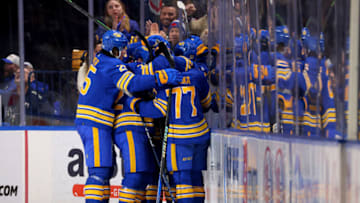 Feb 28, 2023; Buffalo, New York, USA; Buffalo Sabres right wing JJ Peterka (77) celebrates his goal with teammates during the third period against the Columbus Blue Jackets at KeyBank Center. Mandatory Credit: Timothy T. Ludwig-USA TODAY Sports