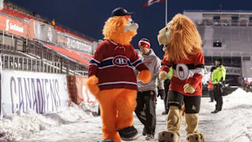 OTTAWA, ON - DECEMBER 16: Mascots Youppie of the Montreal Canadiens and Spartacat of the Ottawa Senators walks along prior to the 2017 Scotiabank NHL 100 Classic at Lansdowne Park on December 16, 2017 in Ottawa, Canada. (Photo by Francois Laplante/Getty Images/Freestyle Photo)