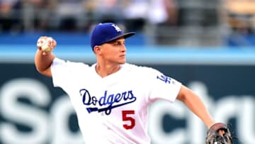 LOS ANGELES, CA - JULY 05: Corey Seager #5 of the Los Angeles Dodgers makes a throw to first for an out of Ketel Marte #4 of the Arizona Diamondbacks during the first inning at Dodger Stadium on July 5, 2017 in Los Angeles, California. (Photo by Harry How/Getty Images)