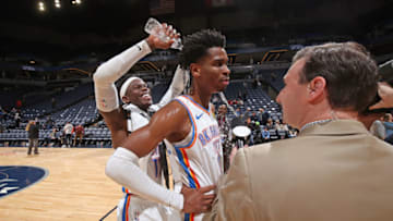 JANUARY 13: Dennis Schroder #17 pours water in celebration on Shai Gilgeous-Alexander #2 of the OKC Thunder on the court after the game against the Minnesota Timberwolves (Photo by David Sherman/NBAE via Getty Images)
