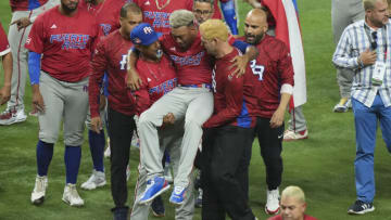 MIAMI, FLORIDA - MARCH 15: Edwin Diaz #39 of Puerto Rico is helped off the field after being injured during the on-field celebration after defeating the Dominican Republic during the World Baseball Classic Pool D at loanDepot park on March 15, 2023 in Miami, Florida. (Photo by Eric Espada/Getty Images)