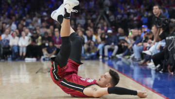 Tyler Herro #14 of the Miami Heat falls to the ground against the Philadelphia 76ers(Photo by Mitchell Leff/Getty Images)