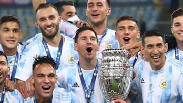 RIO DE JANEIRO, BRAZIL - JULY 10: Lionel Messi of Argentina holds the trophy with teammates after winning the final of Copa America Brazil 2021 between Brazil and Argentina at Maracana Stadium on July 10, 2021 in Rio de Janeiro, Brazil. (Photo by Buda Mendes/Getty Images)