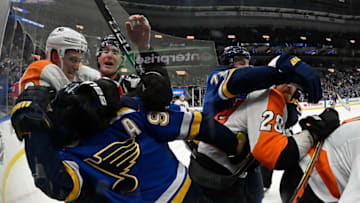 Jan 15, 2020; St. Louis, Missouri, USA; Philadelphia Flyers defenseman Travis Sanheim (6) grabs St. Louis Blues center Ryan O'Reilly (90) during a scuffle in the second period at Enterprise Center. Mandatory Credit: Jeff Curry-USA TODAY Sports