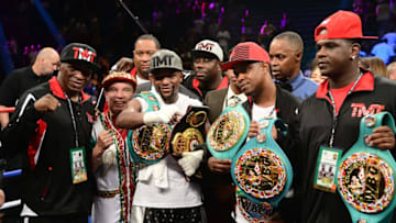 Sep 12, 2015; Las Vegas, NV, USA; Floyd Mayweather (black trunks) celebrates after defeating Andre Berto (not pictured) in their WBA/WBC welterweight title bout at MGM Grand Garden Arena. Mayweather won via unanimous decision. Mandatory Credit: Joe Camporeale-USA TODAY Sports