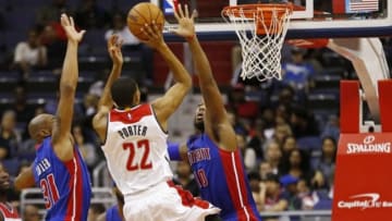 Oct 12, 2014; Washington, DC, USA; Washington Wizards forward Otto Porter Jr. (22) shoots the ball as Detroit Pistons forward Greg Monroe (10) defends in the fourth quarter at Verizon Center. The Wizards won 91-89. Mandatory Credit: Geoff Burke-USA TODAY Sports
