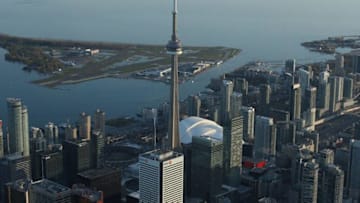 An aerial view of the Toronto city skyline and downtown buildings and Islands and Lake Ontario. (Photo by Tom Szczerbowski/Getty Images)