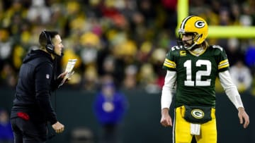 GREEN BAY, WISCONSIN - NOVEMBER 28: Head coach Matt LaFleur and Aaron Rodgers #12 of the Green Bay Packers talk during a timeout by the Los Angeles Rams during the fourth quarter at Lambeau Field on November 28, 2021 in Green Bay, Wisconsin. (Photo by Patrick McDermott/Getty Images)