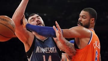 Nov 3, 2013; New York, NY, USA; Minnesota Timberwolves center Nikola Pekovic (14) is fouled by New York Knicks center Tyson Chandler (6) in the first quarter at Madison Square Garden. Mandatory Credit: Noah K. Murray-USA TODAY Sports
