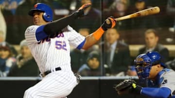 Oct 30, 2015; New York City, NY, USA; New York Mets center fielder Yoenis Cespedes (52) drives in a run with a sacrifice fly against the Kansas City Royals in the sixth inning in game three of the World Series at Citi Field. Mandatory Credit: Anthony Gruppuso-USA TODAY Sports