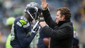 SEATTLE, WA - NOVEMBER 29: Seattle Seahawks general manager John Schneider pats defensive back Jeremy Lane on the helmet before a football game against the Pittsburgh Steelers at CenturyLink Field on November 29, 2015 in Seattle, Washington. The Seahawks won the game 39-30. (Photo by Stephen Brashear/Getty Images)