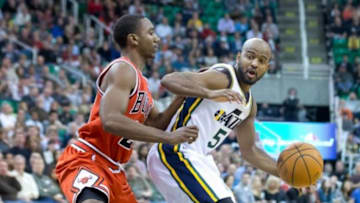 Nov 25, 2013; Salt Lake City, UT, USA; Utah Jazz point guard John Lucas III (5) is defended by Chicago Bulls point guard Marquis Teague (25) during the second half at EnergySolutions Arena. The Jazz won 89-83 in overtime. Mandatory Credit: Russ Isabella-USA TODAY Sports