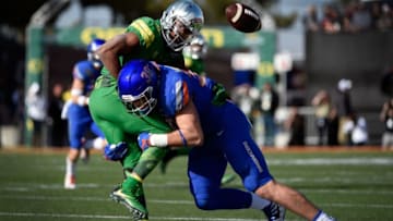 LAS VEGAS, NV - DECEMBER 16: Tony Brooks-James #20 of the Oregon Ducks fumbles the ball under pressure from Leighton Vander Esch #38 of the Boise State Broncos during the first half of the Las Vegas Bowl at Sam Boyd Stadium on December 16, 2017 in Las Vegas, Nevada. Boise State won 38-28. (Photo by David Becker/Getty Images)