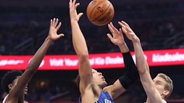 The Chicago Bulls' Justin Holiday, left, and Lauri Markkanen, right, knock the ball away from the Orlando Magic's Aaron Gordon at the Amway Center in Orlando, Fla., on Friday, Nov. 3, 2017. (Stephen M. Dowell/Orlando Sentinel/TNS via Getty Images)
