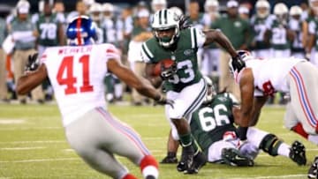Aug 22, 2014; East Rutherford, NJ, USA; New York Jets running back Chris Ivory (33) carries during the third quarter against the New York Giants at MetLife Stadium. New York Giants won 35-24. Mandatory Credit: Anthony Gruppuso-USA TODAY Sports