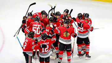 The Chicago Blackhawks celebrate their 3-2 victory against the Edmonton Oilers to win Game Four and the Western Conference Qualification Round. (Photo by Jeff Vinnick/Getty Images)