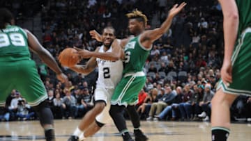 SAN ANTONIO, TX - DECEMBER 14: Kawhi Leonard #2 of the San Antonio Spurs handles the ball against the Boston Celtics on December 14, 2016 at the AT&T Center in San Antonio, Texas. NOTE TO USER: User expressly acknowledges and agrees that, by downloading and or using this photograph, user is consenting to the terms and conditions of the Getty Images License Agreement. Mandatory Copyright Notice: Copyright 2016 NBAE (Photos by Mark Sobhani/NBAE via Getty Images)