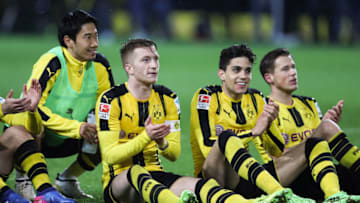 DORTMUND, GERMANY - FEBRUARY 04: Shinji Kagawa (L-R), Marco Reus, Marc Bartra and Erik Durm of Dortmund celebrate after the Bundesliga match between Borussia Dortmund and RB Leipzig at Signal Iduna Park on February 4, 2017 in Dortmund, Germany. (Photo by Maja Hitij/Bongarts/Getty Images)