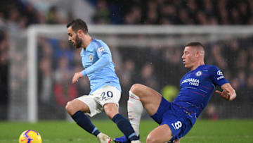 LONDON, ENGLAND - DECEMBER 08: Bernardo Silva of Manchester City is tackled by Ross Barkley of Chelsea during the Premier League match between Chelsea FC and Manchester City at Stamford Bridge on December 8, 2018 in London, United Kingdom. (Photo by Shaun Botterill/Getty Images)