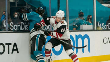 Apr 26, 2021; San Jose, California, USA; San Jose Sharks defenseman Greg Pateryn (2) controls the puck behind the net against Arizona Coyotes left wing Dryden Hunt (28) during the first period at SAP Center at San Jose. Mandatory Credit: Neville E. Guard-USA TODAY Sports