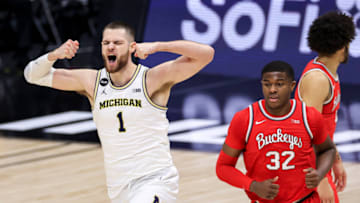 Mar 13, 2021; Indianapolis, Indiana, USA; Michigan Wolverines center Hunter Dickinson (1) reacts after making a shot against the Ohio State Buckeyes in the first half at Lucas Oil Stadium. Mandatory Credit: Aaron Doster-USA TODAY Sports