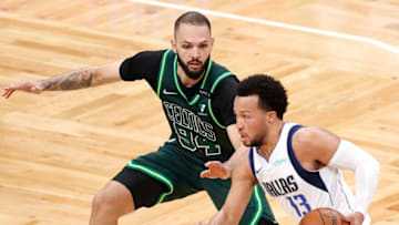BOSTON, MASSACHUSETTS - MARCH 31: Jalen Brunson #13 of the Dallas Mavericks drives against Evan Fournier #94 of the Boston Celtics at TD Garden on March 31, 2021 in Boston, Massachusetts. The Mavericks defeat the Celtics 113-108. (Photo by Maddie Meyer/Getty Images)