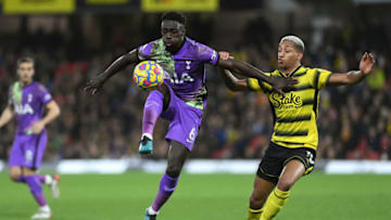 WATFORD, ENGLAND - JANUARY 01: Davinson Sanchez of Tottenham Hotspur holds off Joao Pedro of Watford during the Premier League match between Watford and Tottenham Hotspur at Vicarage Road on January 01, 2022 in Watford, England. (Photo by Justin Setterfield/Getty Images)