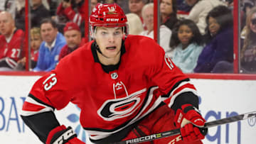 RALEIGH, NC - OCTOBER 09: Carolina Hurricanes Left Wing Warren Foegele (13) skates after a puck during a game between the Vancouver Canucks and the Carolina Hurricanes at the PNC Arena in Raleigh, NC on October 9, 2018. Carolina defeated Vancouver 5 - 3. (Photo by Greg Thompson/Icon Sportswire via Getty Images)