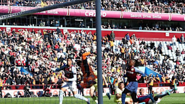 Arsenal's German goalkeeper Bernd Leno (C) dives to save a shot on goal during the English Premier League football match between Aston Villa and Arsenal at Villa Park in Birmingham, central England, on March 19, 2022. - RESTRICTED TO EDITORIAL USE. No use with unauthorized audio, video, data, fixture lists, club/league logos or 'live' services. Online in-match use limited to 120 images. An additional 40 images may be used in extra time. No video emulation. Social media in-match use limited to 120 images. An additional 40 images may be used in extra time. No use in betting publications, games or single club/league/player publications. (Photo by Adrian DENNIS / AFP) / RESTRICTED TO EDITORIAL USE. No use with unauthorized audio, video, data, fixture lists, club/league logos or 'live' services. Online in-match use limited to 120 images. An additional 40 images may be used in extra time. No video emulation. Social media in-match use limited to 120 images. An additional 40 images may be used in extra time. No use in betting publications, games or single club/league/player publications. / RESTRICTED TO EDITORIAL USE. No use with unauthorized audio, video, data, fixture lists, club/league logos or 'live' services. Online in-match use limited to 120 images. An additional 40 images may be used in extra time. No video emulation. Social media in-match use limited to 120 images. An additional 40 images may be used in extra time. No use in betting publications, games or single club/league/player publications. (Photo by ADRIAN DENNIS/AFP via Getty Images)