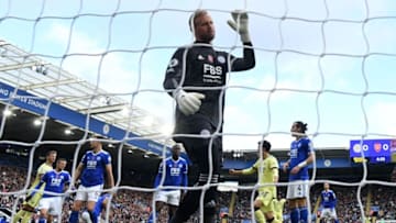 Leicester City's Danish goalkeeper Kasper Schmeichel reacts after Arsenal's Brazilian defender Gabriel scores his team's opening goal during the English Premier League football match between Leicester City and Arsenal at King Power Stadium in Leicester, central England on October 30, 2021. - RESTRICTED TO EDITORIAL USE. No use with unauthorized audio, video, data, fixture lists, club/league logos or 'live' services. Online in-match use limited to 120 images. An additional 40 images may be used in extra time. No video emulation. Social media in-match use limited to 120 images. An additional 40 images may be used in extra time. No use in betting publications, games or single club/league/player publications. (Photo by JUSTIN TALLIS / AFP) / RESTRICTED TO EDITORIAL USE. No use with unauthorized audio, video, data, fixture lists, club/league logos or 'live' services. Online in-match use limited to 120 images. An additional 40 images may be used in extra time. No video emulation. Social media in-match use limited to 120 images. An additional 40 images may be used in extra time. No use in betting publications, games or single club/league/player publications. / RESTRICTED TO EDITORIAL USE. No use with unauthorized audio, video, data, fixture lists, club/league logos or 'live' services. Online in-match use limited to 120 images. An additional 40 images may be used in extra time. No video emulation. Social media in-match use limited to 120 images. An additional 40 images may be used in extra time. No use in betting publications, games or single club/league/player publications. (Photo by JUSTIN TALLIS/AFP via Getty Images)