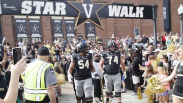 NASHVILLE, TENNESSEE - SEPTEMBER 28: head coach Derek Mason of the Vanderbilt Commodores walks to the stadium with Tyler Steen #54 and Cole Clemens #74 prior to a game against the Northern Illinois Huskies at Vanderbilt Stadium on September 28, 2019 in Nashville, Tennessee. (Photo by Frederick Breedon/Getty Images)