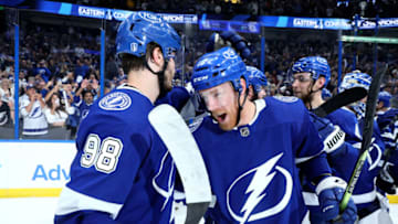 TAMPA, FLORIDA - JUNE 11: Mikhail Sergachev #98 and Riley Nash #16 of the Tampa Bay Lightning celebrate after defeating the New York Rangers with a score of 2 to 1 in Game Six to win the Eastern Conference Final of the 2022 Stanley Cup Playoffs at Amalie Arena on June 11, 2022 in Tampa, Florida. (Photo by Andy Lyons/Getty Images)
