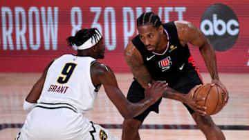 LAKE BUENA VISTA, FLORIDA - SEPTEMBER 05: Kawhi Leonard (2) of the LA Clippers drives the ball against Jerami Grant (9) of the Denver Nuggets during the first quarter in Game Two of the Western Conference Second Round during the 2020 NBA Playoffs at AdventHealth Arena at the ESPN Wide World Of Sports Complex on September 05, 2020 in Lake Buena Vista, Florida. NOTE TO USER: User expressly acknowledges and agrees that, by downloading and or using this photograph, User is consenting to the terms and conditions of the Getty Images License Agreement. (Photo by Douglas P. DeFelice/Getty Images)
