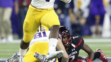 Dec 29, 2015; Houston, TX, USA; LSU Tigers running back Leonard Fournette (7) rushes against the Texas Tech Red Raiders in the first quarter at NRG Stadium. Mandatory Credit: Thomas B. Shea-USA TODAY Sports