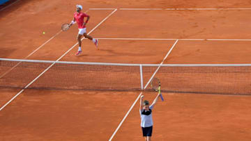 Serbian tennis player Novak Djokovic reacts after exchanigig shots with a ball boy during an exhibition single match at a charity exhibition hosted by Novak Djokovic, on June 13, 2020 in Belgrade. - The ATP and WTA Tours have been suspended since March due to the COVID-19 pandemic and will not resume at least until the end of July 2020. (Photo by Andrej ISAKOVIC / AFP) (Photo by ANDREJ ISAKOVIC/AFP via Getty Images)