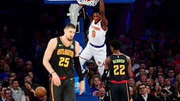 NEW YORK, NEW YORK - DECEMBER 17: RJ Barrett #9 of the New York Knicks dunks the ball as Alex Len #25 of the Atlanta Hawks looks on during the first half of their game at Madison Square Garden on December 17, 2019 in New York City. NOTE TO USER: User expressly acknowledges and agrees that, by downloading and or using this photograph, User is consenting to the terms and conditions of the Getty Images License Agreement. (Photo by Emilee Chinn/Getty Images)