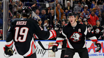 Jan 21, 2023; Buffalo, New York, USA; Buffalo Sabres center Peyton Krebs (19) celebrates his goal with defenseman Rasmus Dahlin (26) during the second period against the Anaheim Ducks at KeyBank Center. Mandatory Credit: Timothy T. Ludwig-USA TODAY Sports
