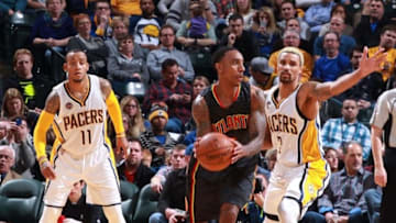 Jan 28, 2016; Indianapolis, IN, USA; Atlanta Hawks guard Jeff Teague (0) dribbles the ball as Indiana Pacers guard George Hill (3) defends at Bankers Life Fieldhouse. The Pacers won 111-92. Mandatory Credit: Brian Spurlock-USA TODAY Sports