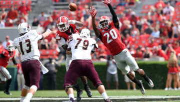 Sep 5, 2015; Athens, GA, USA; Georgia Bulldogs linebacker Leonard Floyd (84) and safety Quincy Mauger (20) defend against a pass by Louisiana Monroe Warhawks quarterback Garrett Smith (13) during the second half at Sanford Stadium. Georgia defeated Louisiana Monroe 51-14 in a game shortened by thunder storms. Mandatory Credit: Dale Zanine-USA TODAY Sports