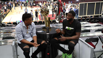 CLEVELAND, OH - JUNE 5: Donovan Mitchell of the Utah Jazz interviews Draymond Green of the Golden State Warriors during practice and media availability as part of the 2018 NBA Finals on June 5, 2018 at Quicken Loans Arena in Cleveland, Ohio. NOTE TO USER: User expressly acknowledges and agrees that, by downloading and or using this photograph, User is consenting to the terms and conditions of the Getty Images License Agreement. Mandatory Copyright Notice: Copyright 2018 NBAE (Photo by David Dow/NBAE via Getty Images)