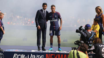 PARIS, FRANCE - AUGUST 05: Neymar poses with president Nasser Al-Khelafi during his presentation to the fan during the French Ligue 1 match between Paris Saint Germain and Amiens SC at Parc des Princes on August 5, 2017 in Paris, France (Photo by Xavier Laine/Getty Images)