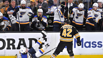BOSTON, MA - MAY 29: Boston Bruins right wing David Backes (42) knocks St. Louis Blues left wing Sammy Blais (9) off his feet and to the ice. During Game 2 of the Stanley Cup Finals featuring the Boston Bruins against the St. Louis Blues on May 29, 2019 at TD Garden in Boston, MA. (Photo by Michael Tureski/Icon Sportswire via Getty Images)