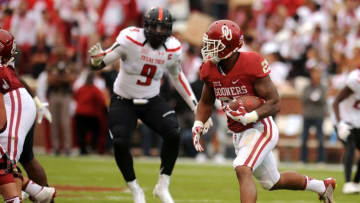 Oct 24, 2015; Norman, OK, USA; Oklahoma Sooners running back Joe Mixon (25) runs the ball against the Texas Tech Red Raiders during the third quarter at Gaylord Family - Oklahoma Memorial Stadium. Mandatory Credit: Mark D. Smith-USA TODAY Sports