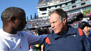 Oct 9, 2022; Foxborough, Massachusetts, USA; New England Patriots head coach Bill Belichick and Detroit Lions defensive coordinator Aaron Glenn meet at midfield at Gillette Stadium. Mandatory Credit: Bob DeChiara-USA TODAY Sports