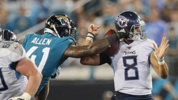 JACKSONVILLE, FLORIDA - SEPTEMBER 19: Josh Allen #41 of the Jacksonville Jaguars forces a fumble by Marcus Mariota #8 of the Tennessee Titans during the fourth quarter of a game at TIAA Bank Field on September 19, 2019 in Jacksonville, Florida. (Photo by James Gilbert/Getty Images)
