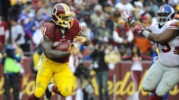 Nov 29, 2015; Landover, MD, USA; Washington Redskins running back Matt Jones (31) carries the ball against the New York Giants during the second half at FedEx Field. The Redskins won 20-14. Mandatory Credit: Brad Mills-USA TODAY Sports